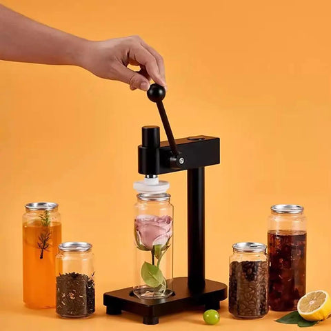 Manual Pull Tab Can Sealer in use with glass jar, lightweight aviation aluminum body and iron base for home and commercial use.