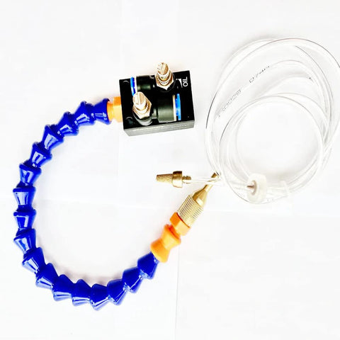 BACHIN mist coolant spray system with blue flexible articulated hose, brass fittings, and clear tubing.
