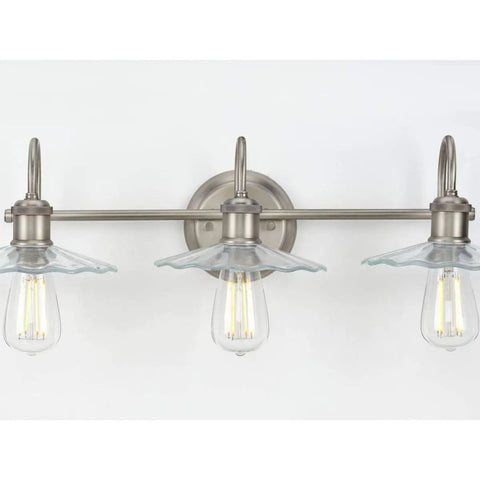 Fayette Collection 3-Light Clear Glass Farmhouse Bath Vanity Light Antique Nickel, wall-mounted with glass shades.
