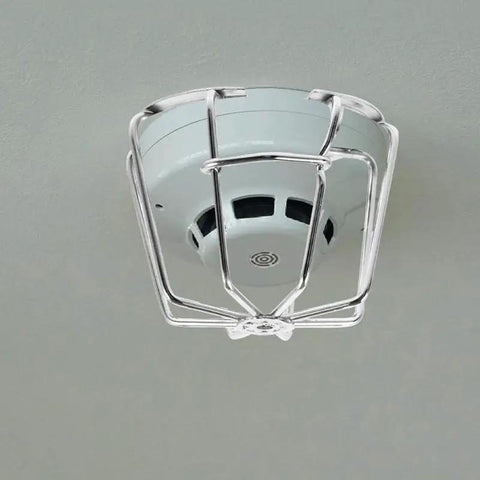 Fire Sprinkler Head Guard Protective Cover Cage Ceiling Impact Resistant Shield mounted on the ceiling, showing its protective design.