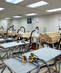 Workshop with Quick Click 16 Foot Commercial Vacuum Hose With Expanded Multi Brand Power Tool Adapter Set connected to tools