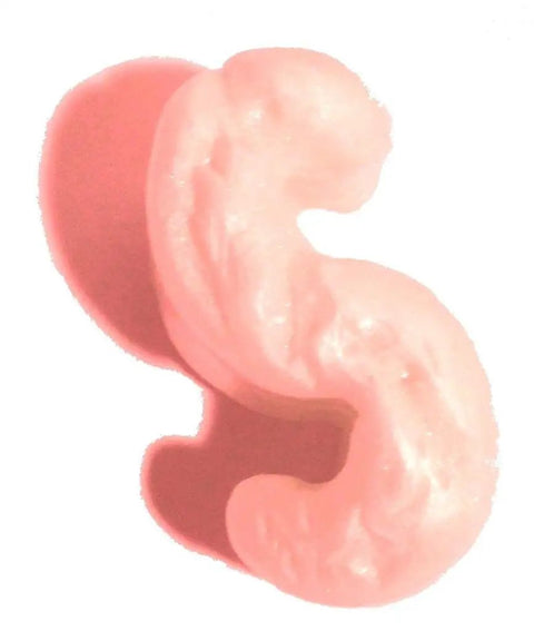 Close-up of pink anti-static interlocking S-shaped packing peanut, part of Pink Anti Static Packing Peanuts 3.5 Cubic Feet 22.5 Gallons Interlocking S Shaped Cushioning Pellets Perfect For Packing Bead Bags Bean Bags Planters And More Non Water Soluble Temperature Resistant And Easy To Dispense