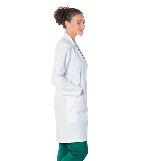 Side profile of a woman wearing a Relaxed Fit Five Pocket Three Button Full Length White Medical Lab Coat For Women.