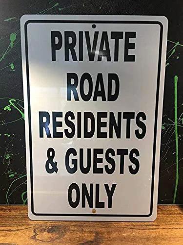 Metal aluminum sign with PRIVATE ROAD RESIDENTS & GUESTS ONLY in black on silver; front view.