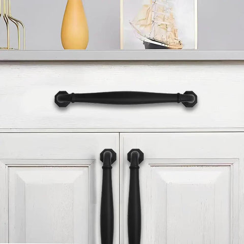 10 Pack 4 Inch Hole Center Matte Black Heavy Duty Solid Cabinet Pulls installed on white cabinet doors and drawers.