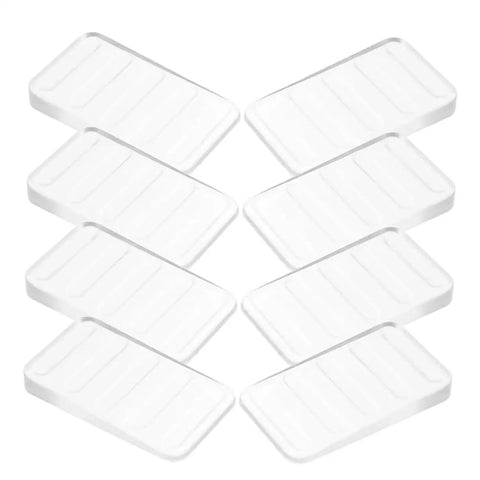 Clear Plastic Leveling Shims For Furniture Wobble Fix 32 Piece Wedge Set arranged in a grid, ideal for stabilizing furniture.