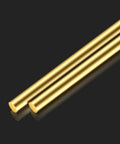 Two Brass Rods Twelve Inches Long, Three Eighths Inch Diameter Round Stock Lathe Bar For DIY Crafts on a dark background