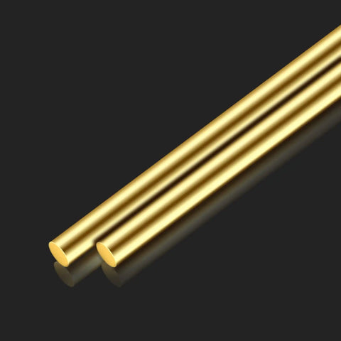 Two Brass Rods Twelve Inches Long, Three Eighths Inch Diameter Round Stock Lathe Bar For DIY Crafts on a dark background
