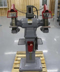 Shop Beast 12 Inch Bench Grinder Fueled by a 3 Horsepower 3 Phase Motor with Versatile 208 230 460 Volt Support Crushing Metals at 1500 1800 Rpm, front view on a wooden pallet.