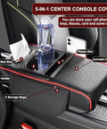 Waterproof Faux Leather Armrest Box Mat With Dual Cup Holders, Phone Slot, Tissues, Side Pockets, Elastic Straps, And Absorbent Cup Coaster, Quilted Elbow Rest For Long Drives, Keeps Your Ride Clean, Organized, And Comfy. 5-in-1 center console cover with phone slot, tissue box slot, cup holder, and storage bags