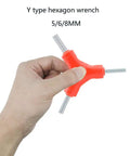 Y Shaped Bicycle Wrench Tool Set for Quick Bike Repairs with External Three Way Hex Wrenches 5 6 8 Mm held in hand
