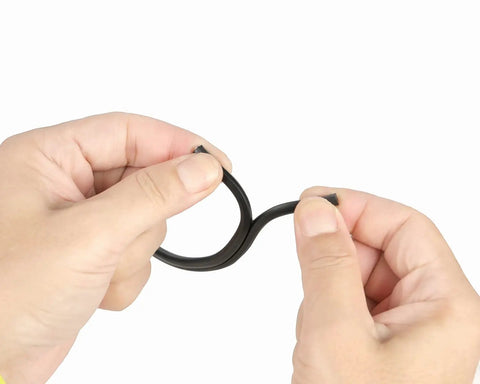 Hands holding 12/2 Gauge Low Voltage Landscape Wire, 200 Feet Outdoor Lighting Cable, showing wire flexibility.