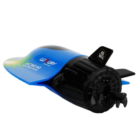 Close-up of blue Mini RC Submarine Boat Remote Control Waterproof Diving Toy with tail fins and propeller visible.