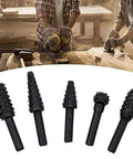 Five black rotary burr bits with textured cutting heads and metal shanks for carving and grinding