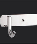 Close-up of the Total Game Changer Wall Mount Coat Rack Flip Down Swivel Hooks Sculptural Polypropylene Art for Bathroom Kitchen.