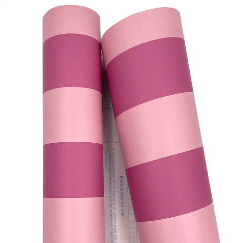 Rose Pink Stripe Peel And Stick Wallpaper Self Adhesive Vinyl Removable Wall Covering For Cabinets Drawers DIY Room Flip With A Rad Chic Vibe Easy Apply Covers Forty Eight Total Sq Ft showing two rolls with pink and magenta stripes.