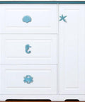 4 Piece Mediterranean Blue Iron Cabinet Knobs Set With Seahorse, Starfish, Crab, And Shell Handles on white cabinet