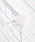 Close-up of assembly connector on Premium Wire Cube Storage Organizer for home and garage four cube shelving unit heavy duty wire construction.