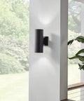 12 Inch Cylindrical Outdoor Wall Sconce In Black With Dual Up And Down Ambient Lighting, 2 Light Exterior Fixture on deck