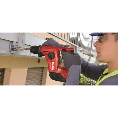 Worker using Kwik Bolt Mechanical Setting Tool for 12 In TEC Anchors, Overhead Friendly and No Hammer Required on metal structure