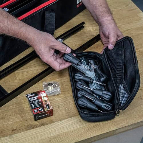 All-In-One Adjustable Door Hinge Jig Installation Kit For 2 Ft 6 In To 9 Ft Doors shown on table, with accessories in black case