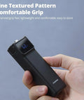 Hand holding Power Bank Grip For Pocket 3 And Pocket 4 Camera With 5000 mAh Battery LED Display 18 Watt USB C Charging
