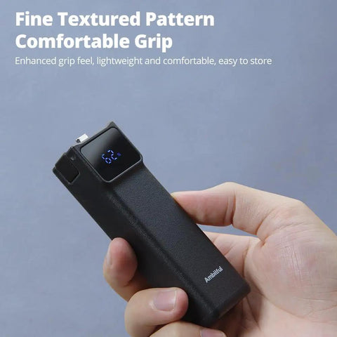 Hand holding Power Bank Grip For Pocket 3 And Pocket 4 Camera With 5000 mAh Battery LED Display 18 Watt USB C Charging