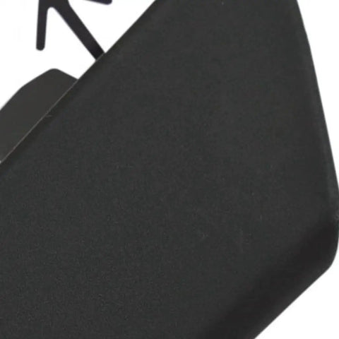 Close-up of Toyota Corolla Front Bumper Tow Eye Cover for 2020 2021 L LE XLE Models Primed OEM Replacement Part featuring surface texture.