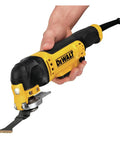 Person using Oscillating Tool With 3 Amp Corded Motor, Quick Change Attachments, Dual Grip Variable Speed Trigger, Bright LED