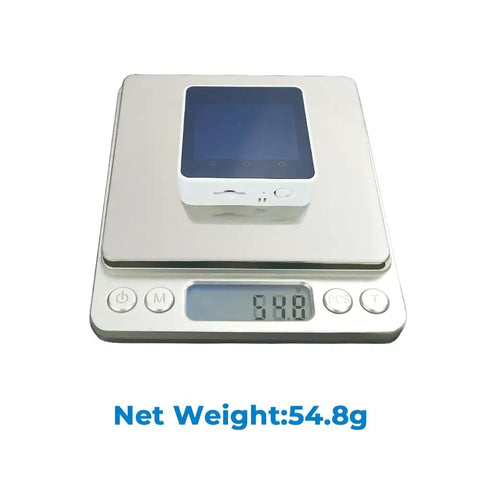 Core2 ESP32 IoT Development Kit V1.1 on digital scale showing net weight of 54.8g