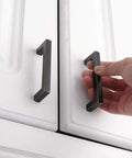 Oil Rubbed Bronze Cabinet Pulls 3 Inch 10 Pack Solid Metal Handles installed on white cabinet with smooth rounded edges