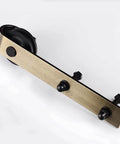 Brass Sliding Barn Door Hardware Kit In Brushed Gold Finish Heavy Duty Carbon Steel Track System With 200 Lb Weight Capacity Fits Standard Interior Doors Includes Two 1000 Millimeter Tracks Five Spacers Two Rollers Two Stoppers And Anti Jump close-up view of roller.