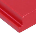 Close-up of red aluminum alloy sliding nut corner for T track systems with dual metric threads