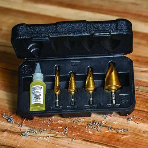Heavy Duty Step Drill Bit Set For DIY With Spiral Double Fluted Titanium Nitride Coated Bits, Pro Grade Four Piece From Half Inch To One And Three Eighths Inch Sizes, Quarter Inch Shank, In Rugged Carry Case Klein Tools displayed in a black case.
