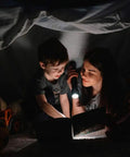 Mother reading to son with flashlight using L2 LED Bulb 2000 Lumen Drop In P60 Module For Flashlight Repair Replacement Cool White Light