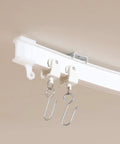 Easy Glide Ceiling Curtain Track System Flexible Durable Design for Effortless Gliding with hooks visible in close-up