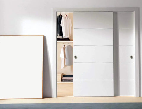 Modern White Bypass Sliding Closet Doors With Solid Core Construction And Complete Hardware Package Featuring Heavy Duty Rollers Slick Matte Finish Delivers Smooth Glide Operation For Fast Room Refresh in open position showing closet.