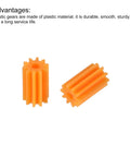 Two orange plastic gears from the 20 Pcs Plastic Gears Set With 10 Tooth Reduction Gears 102A For RC Cars And DIY Robots