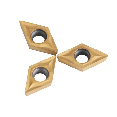 Three tungsten carbide DCMT070204 lathe inserts, diamond-shaped with center bore for metal cutting.