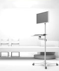 Heavy Duty Floor Standing Monitor Stand With Slick Rolling Wheels And Fold Away Keyboard Tray Fits 10 To 34 Inch Screens ergonomic setup in modern office.