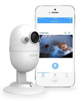 CapsuleCam Pro Baby Monitor 2 Pack Dope 1080P HD WiFi Indoor Security Cam and phone showing baby on app screen.