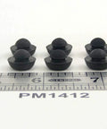 Black ridged SBR rubber push-in bumpers next to ruler, Ridged SBR Rubber Push In Bumper One Half Inch Diameter Five Thirty Second Inch Height Fits One Quarter Inch Hole Panel Thickness One Sixteenth Inch Flat Cushioned Surface Protects Surfaces From Damage Temperature Range Minus Twenty To One Hundred Eighty