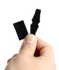 Hand holding Drop Away Arrow Rest Felt Kit with 2 pairs felt tapes and 2 arrow holder pads adhesive for compound bows.