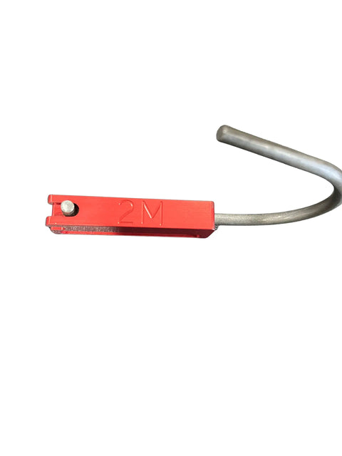 Close-up of Made In The USA Red Anodized Aluminum Cordless Tool Holder with metal hook for easy attachment.