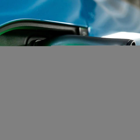 Close-up of a waterproof charging port cover on an electric vehicle, showcasing its secure suction cup seal for protection.