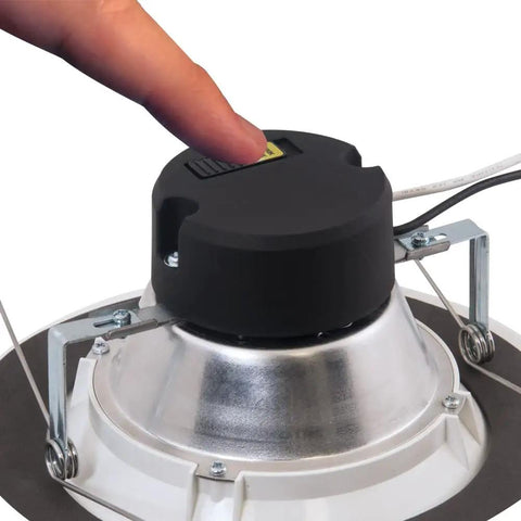 Person adjusting Upgrade Recessed Lighting With A Six Pack Of Indoor Outdoor LED Retrofit Trim Can Lights In 5 Inch And 6 Inch Sizes