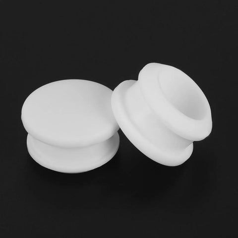Slick Snap In Locking Silicone Hole Plugs For Round Rubber Panel Seal Covers And Waterproof Bulkhead Caps Hella Tough Flush Mount Design Pack Of Sixteen White Pieces on black background.