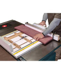 Dead Nuts Accurate Crosscut Sled For Table Saws And Router Tables used with purple wood on a table saw for precise cutting.