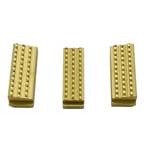 Heavy Duty Beefed Up Gripper Set P32.1222 P32.1223 P32.1224 for P322 P324 P318 Battery Powered Plastic Strapping Tool Durable Replacement Parts Easy Fit Pro Quality Performance Keeps Your Tool Running Strong. Three gold metal grippers shown
