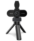 Crisp 1080P HD Webcam With Clear Mic And Noise Cancellation Ships With Wide Angle Lens Auto Light Correction Plus Privacy Cover on tripod.